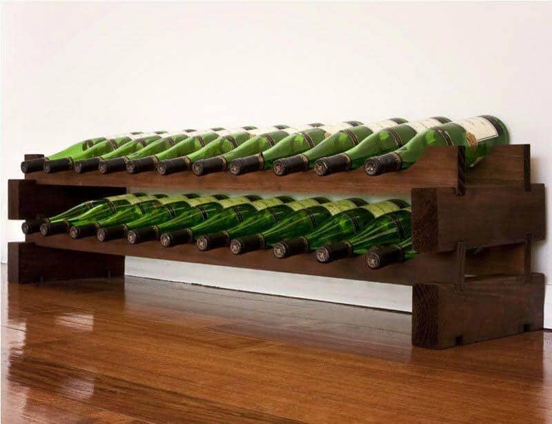 Stained wood Modularack 2x11 22-bottle wine rack on wood flooring
