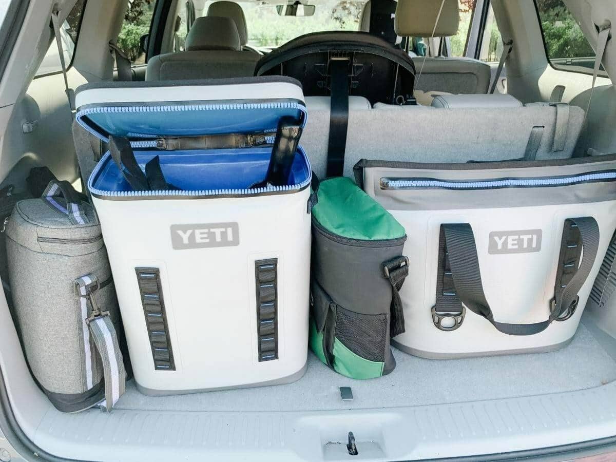 YETI soft coolers and bags packed into a car trunk for a wine outing