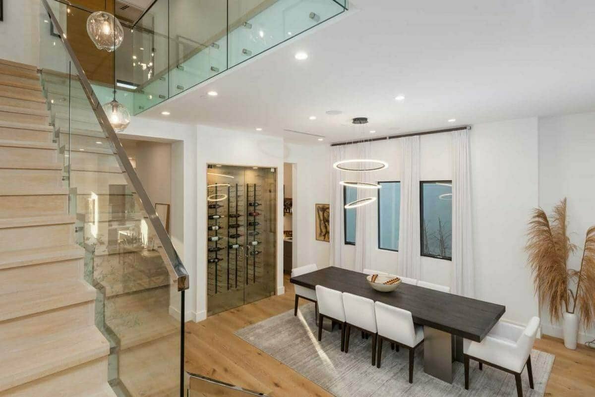 Restaurant hallway lined with a glass-front wine display cabinet