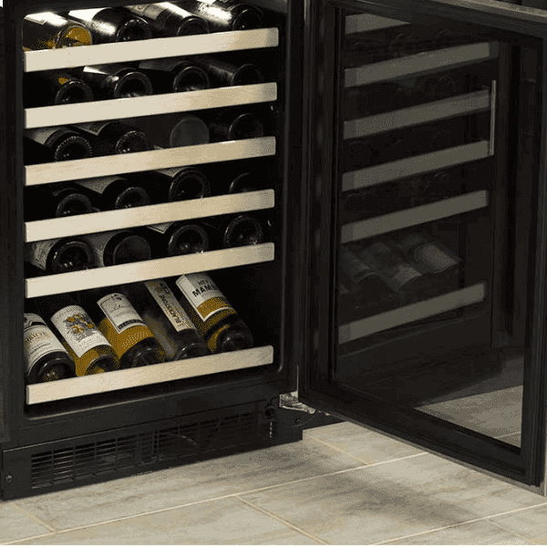 Wine bottles arranged on a Marvel wine refrigerator's wood-trimmed shelf