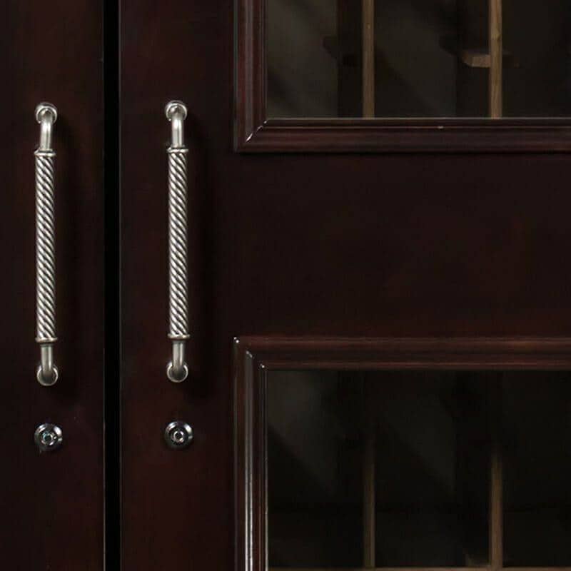 Close-up of Le Cache chocolate finish cabinet door handles and glass panels