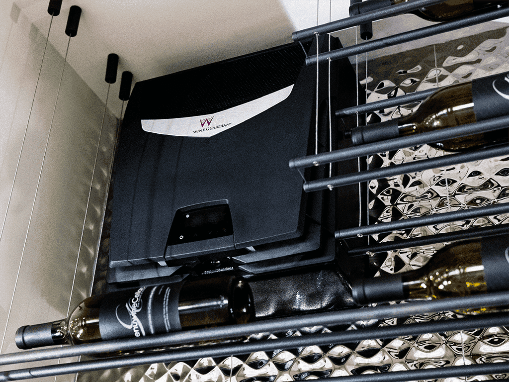 A Wine Guardian cooling unit installed above a mirrored wine rack