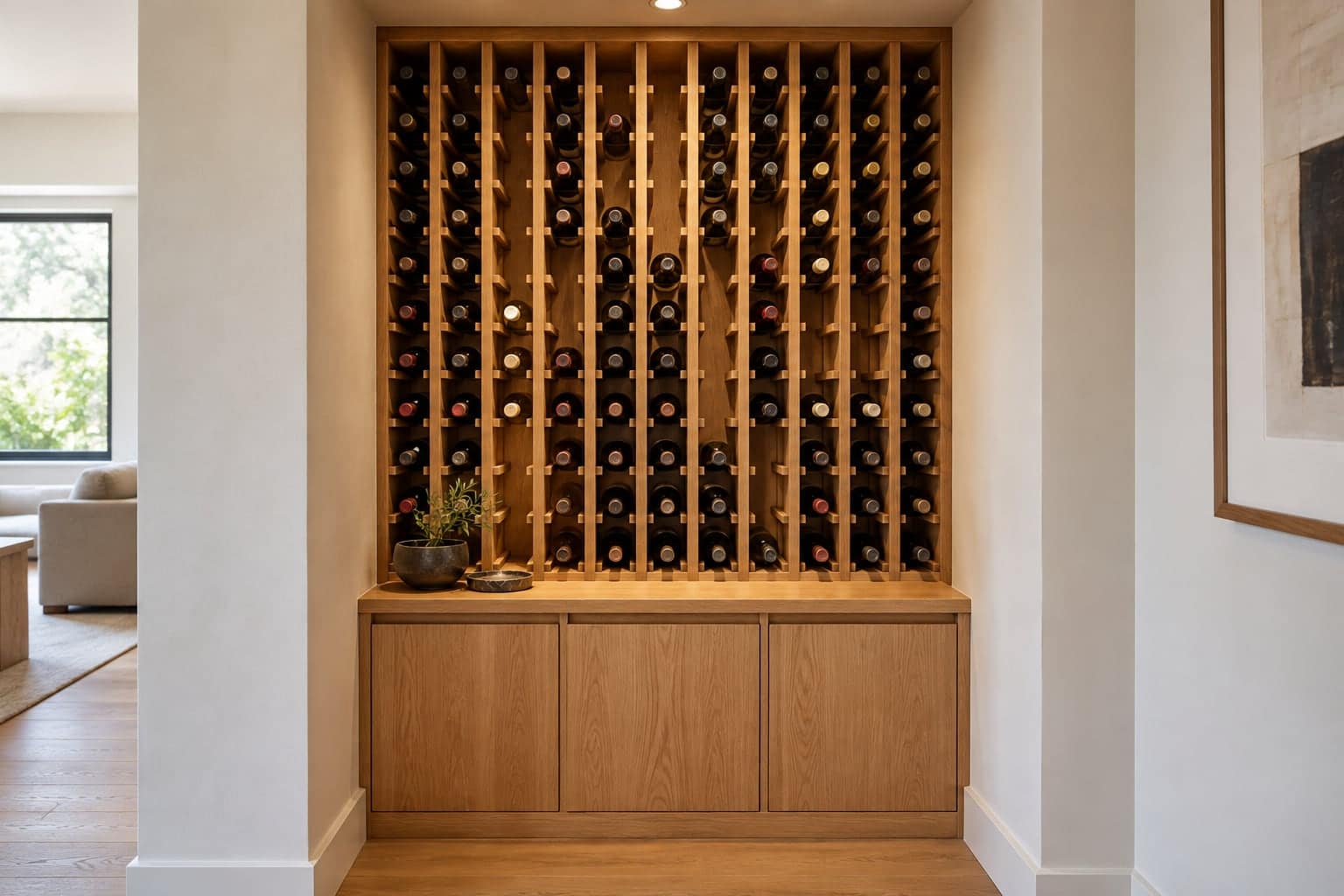 Built-in oak diamond-bin wine rack filled with bottles in a hallway nook