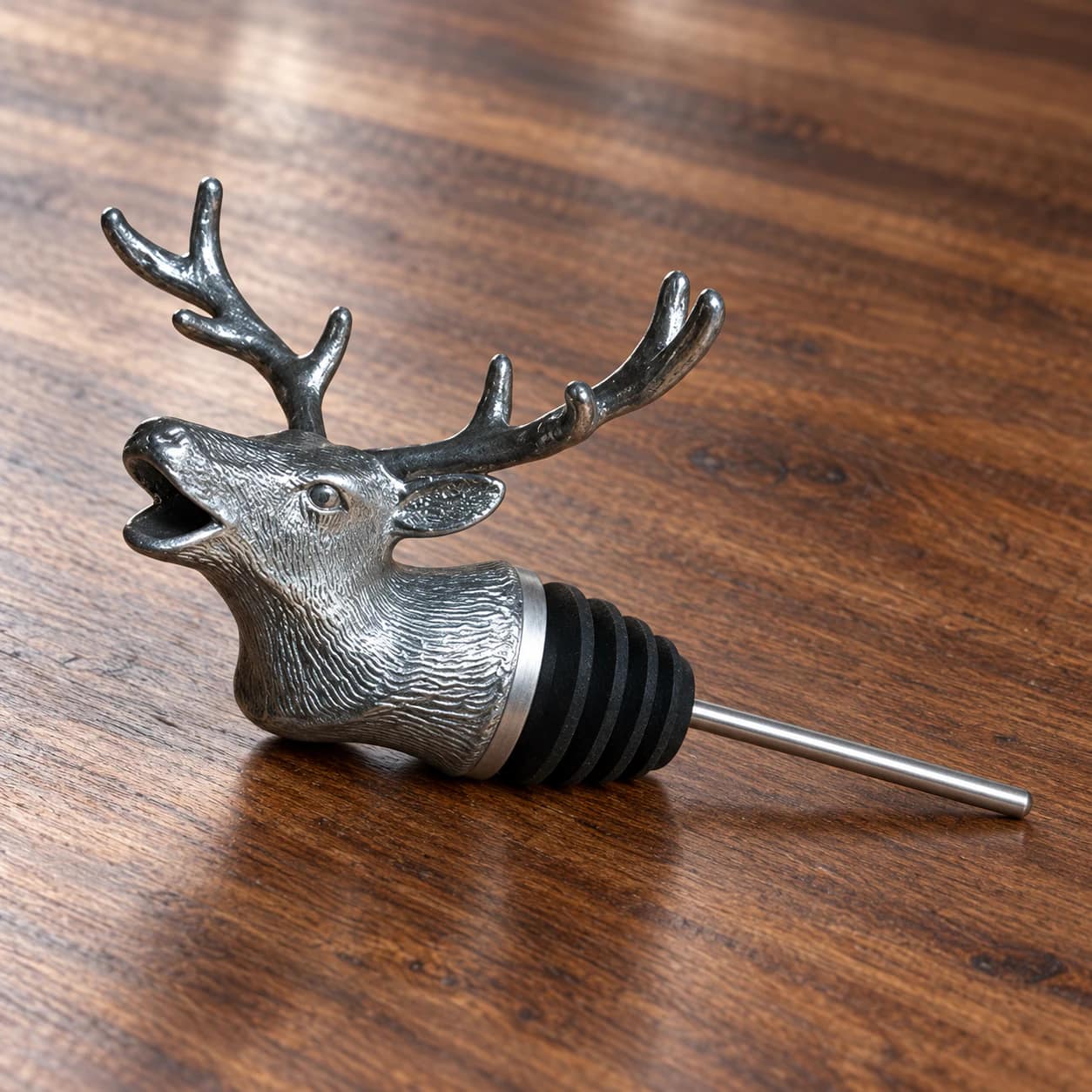 Stag Menagerie wine pourer resting on a walnut counter