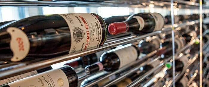 Evolution Wine Tower cable rack holding an assortment of labeled wine bottles