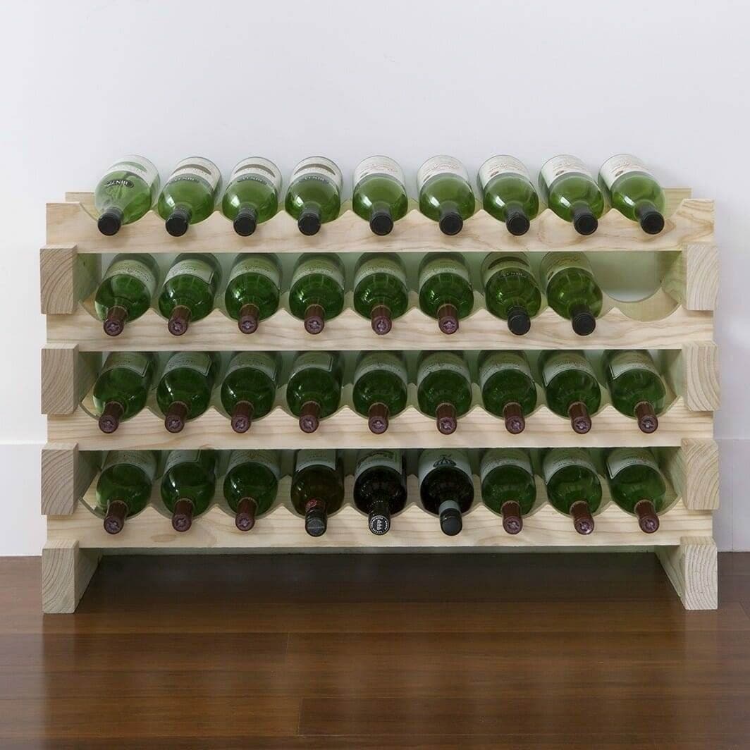 Natural pine modular wine rack holding green wine bottles