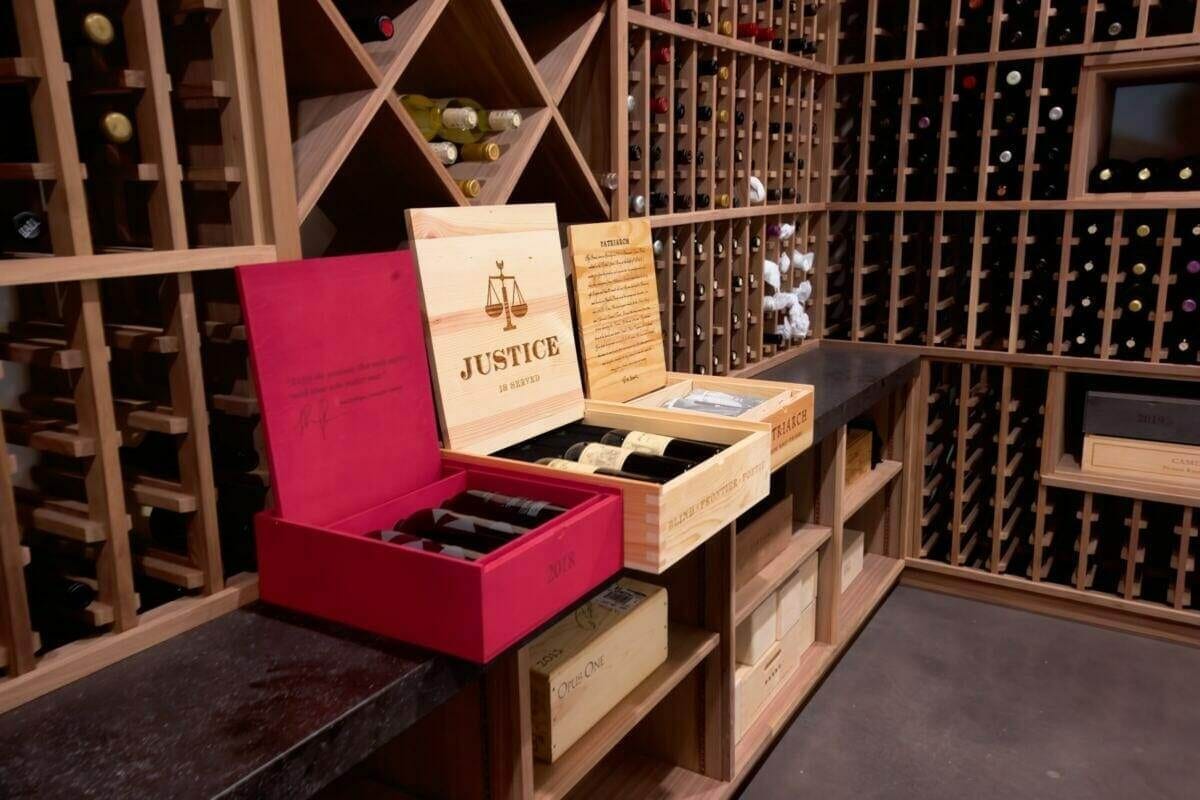 Open wooden wine cases sit beneath diamond bins and individual bottle slots.