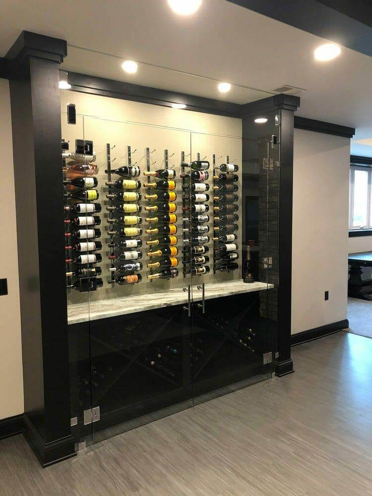 Glass-front wine cellar cabinet with mirrored back and stemware