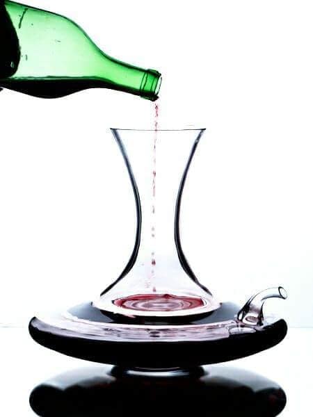 Wine Science decanter with red wine pouring in from a bottle