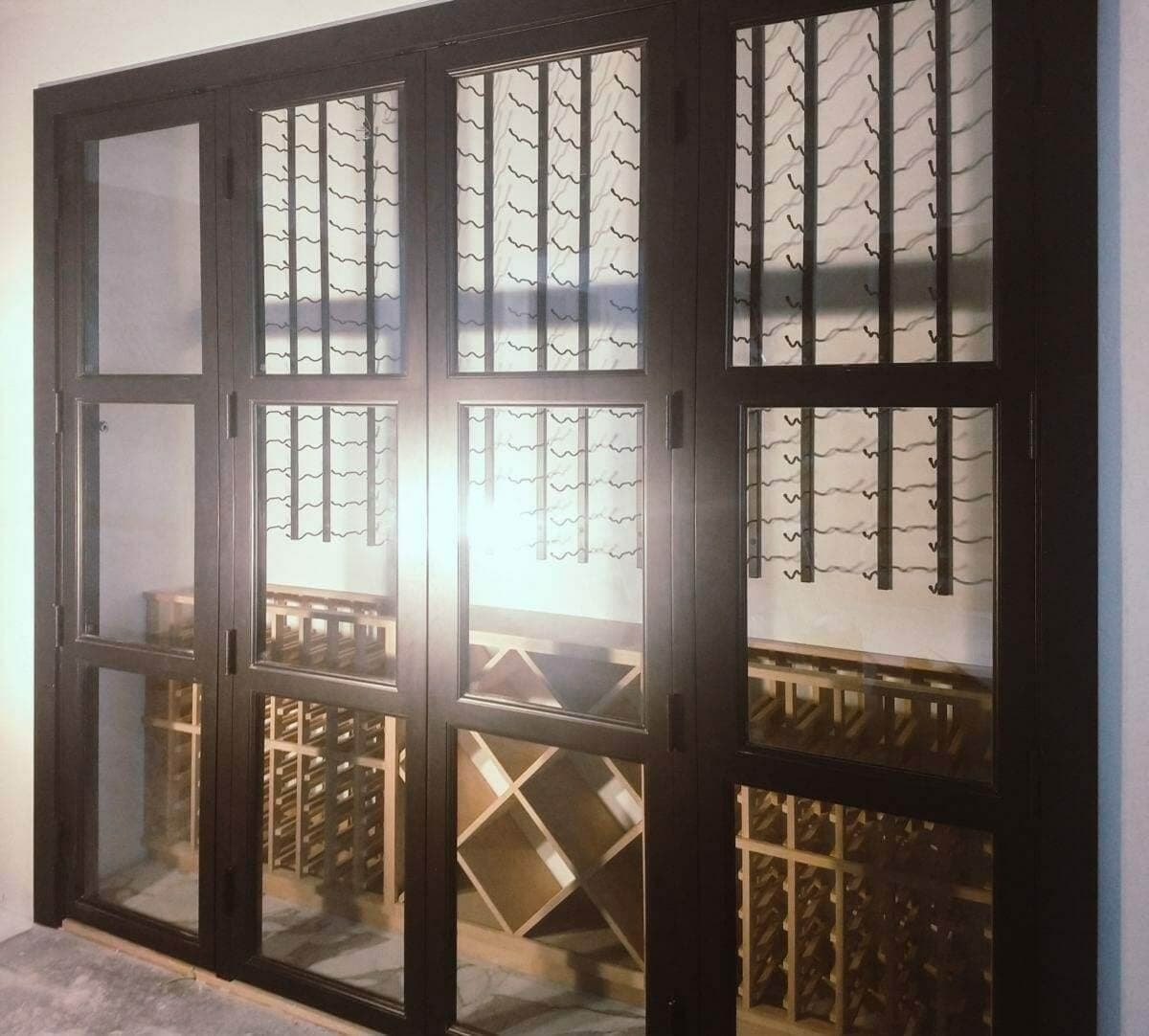 Dark-framed glass wine cabinet holding rows of stored bottles