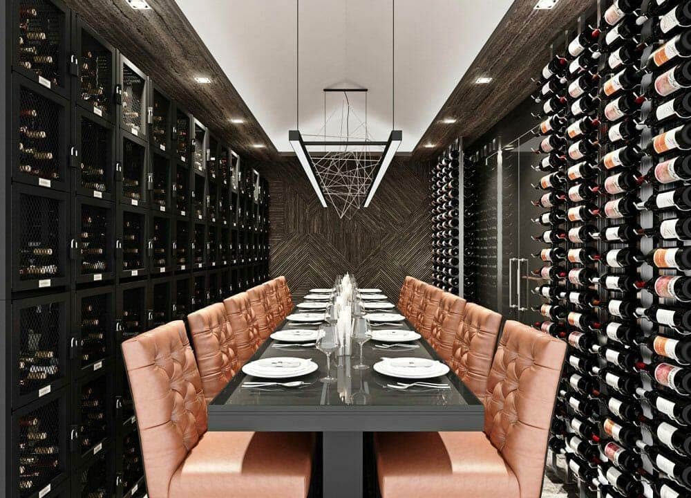 Restaurant private dining room with leather banquettes flanked by wine walls