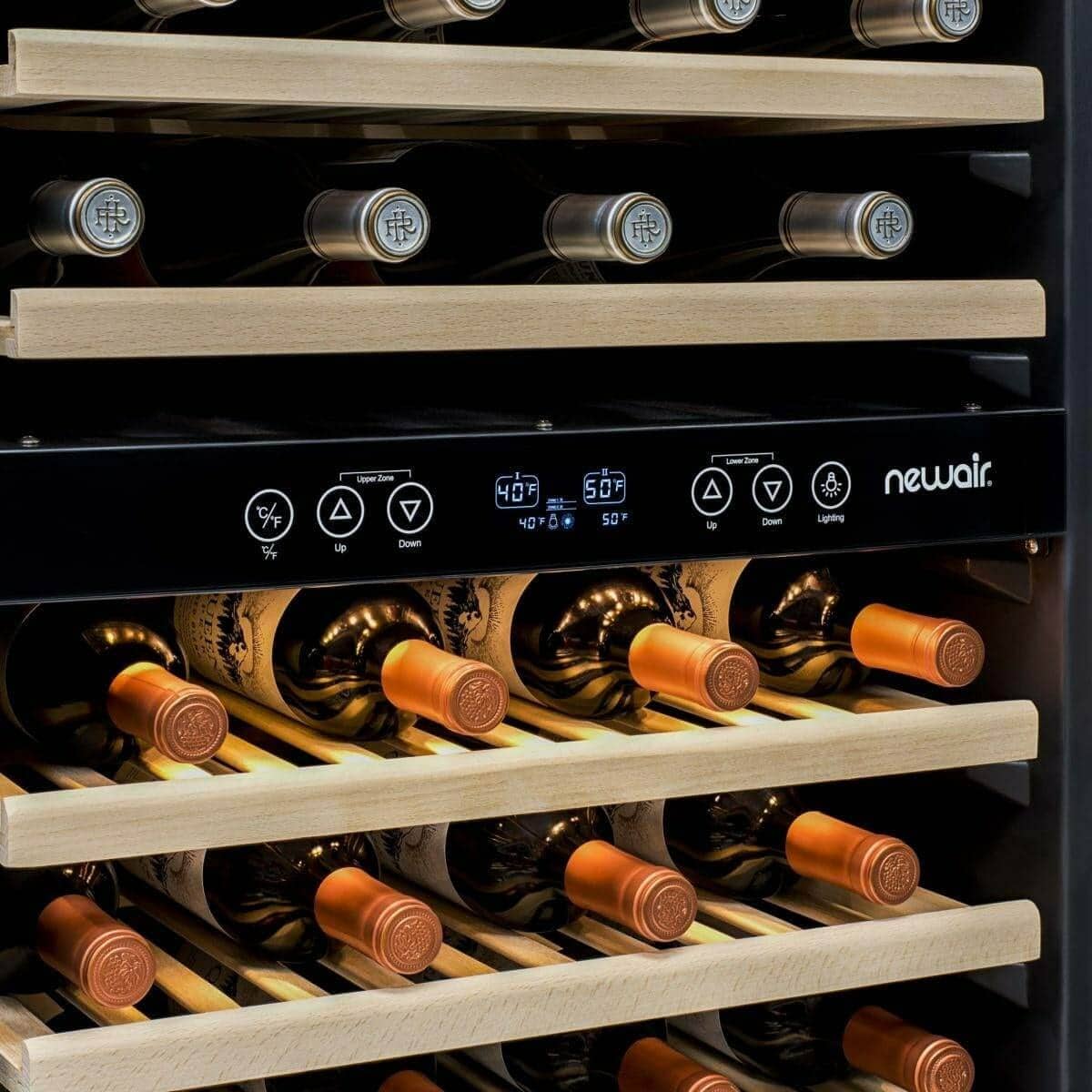 Close-up of wine bottles and control panel inside a NewAir wine fridge