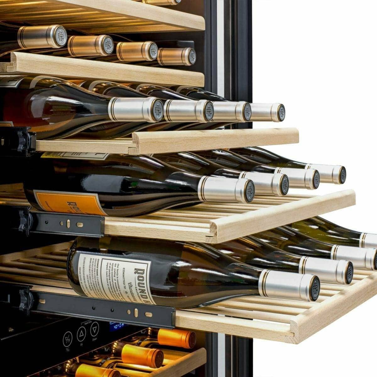 Close-up of wine bottles resting on pull-out shelves in a wine fridge