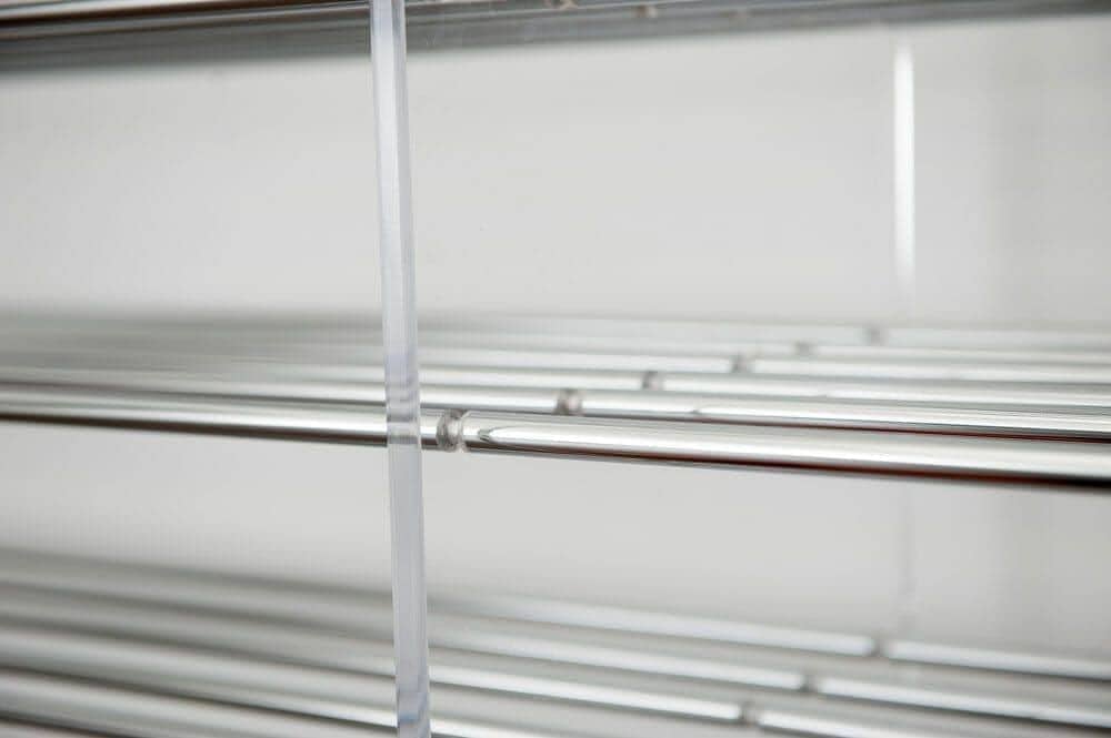 Close-up of an acrylic panel edge on an Evolution wine rack