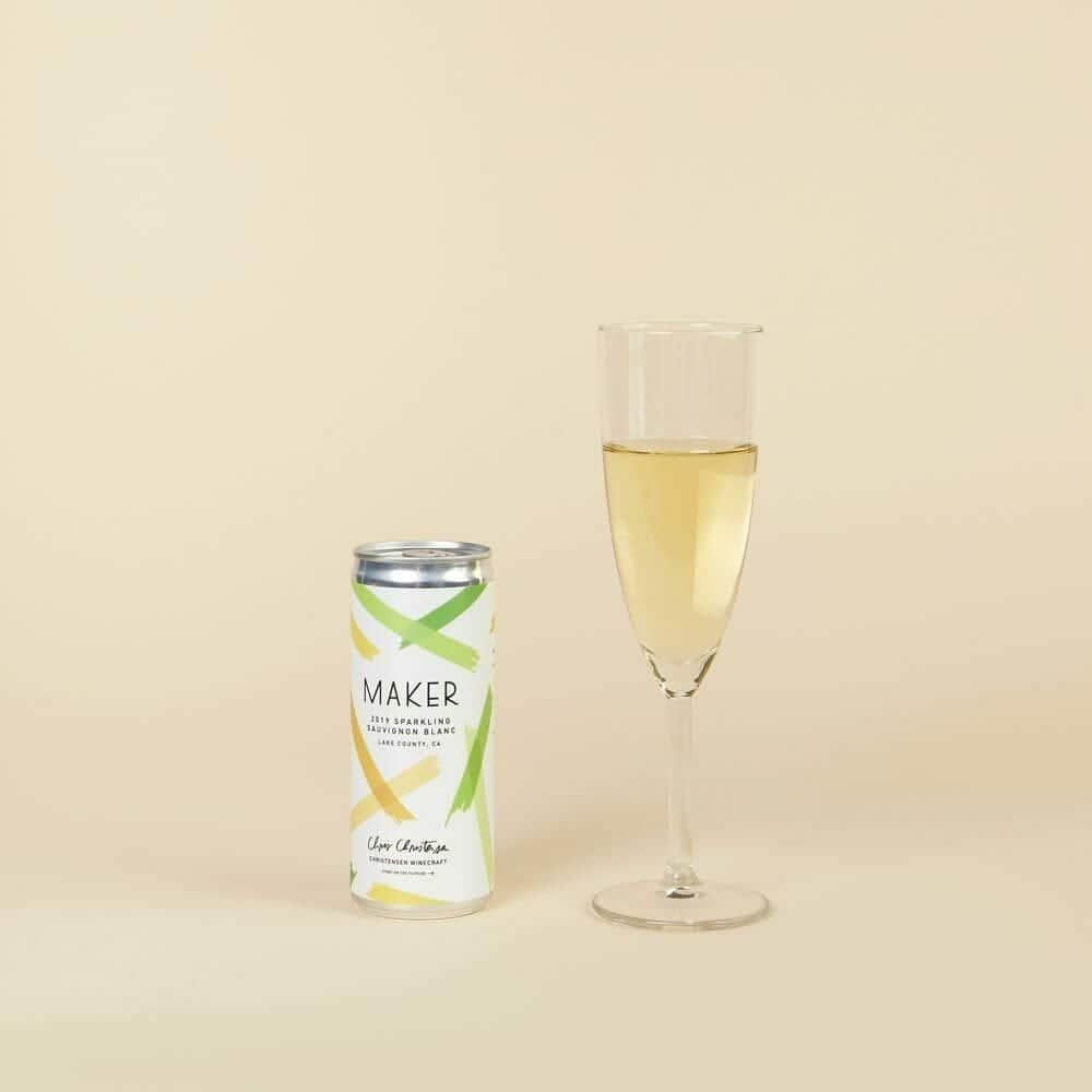 Maker Sparkling Sauvignon Blanc can beside a filled champagne flute