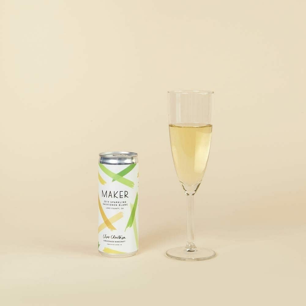 Maker Sparkling Sauvignon Blanc can beside a filled champagne flute