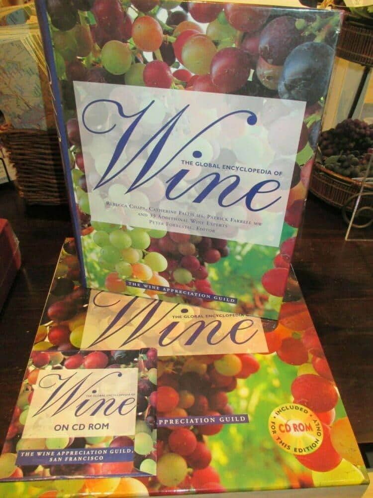 Global Encyclopedia of Wine boxed set displayed on a retail store shelf with grape decor