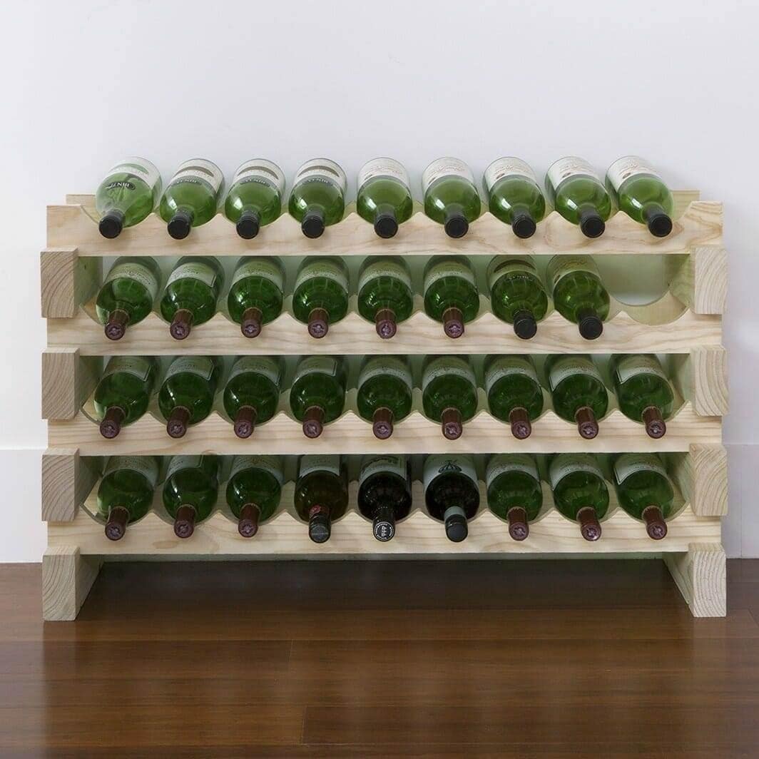 Natural pine modular wine rack holding green wine bottles