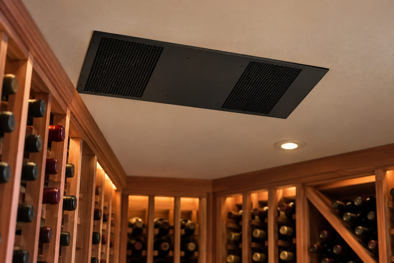 WhisperKOOL Mini Ceiling Mount – Ductless 220 Volt on a walnut showroom table in front of a redwood wine wall