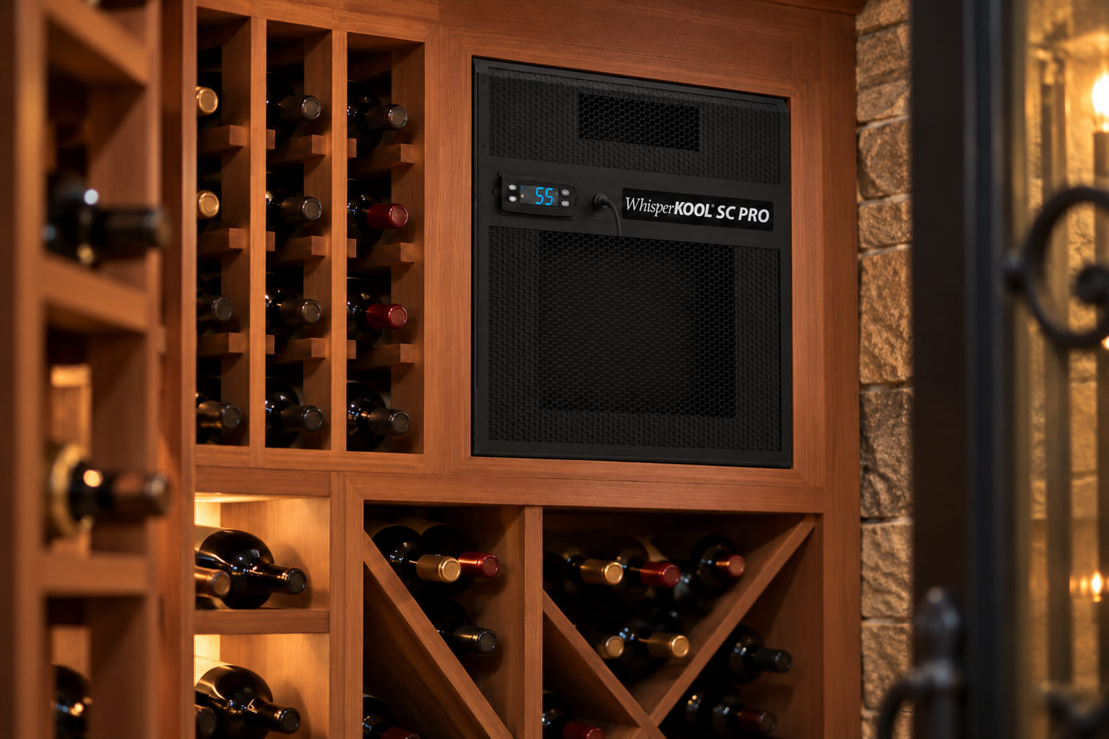 WhisperKOOL SC PRO 4000 installed through the wall of a redwood-racked home wine cellar