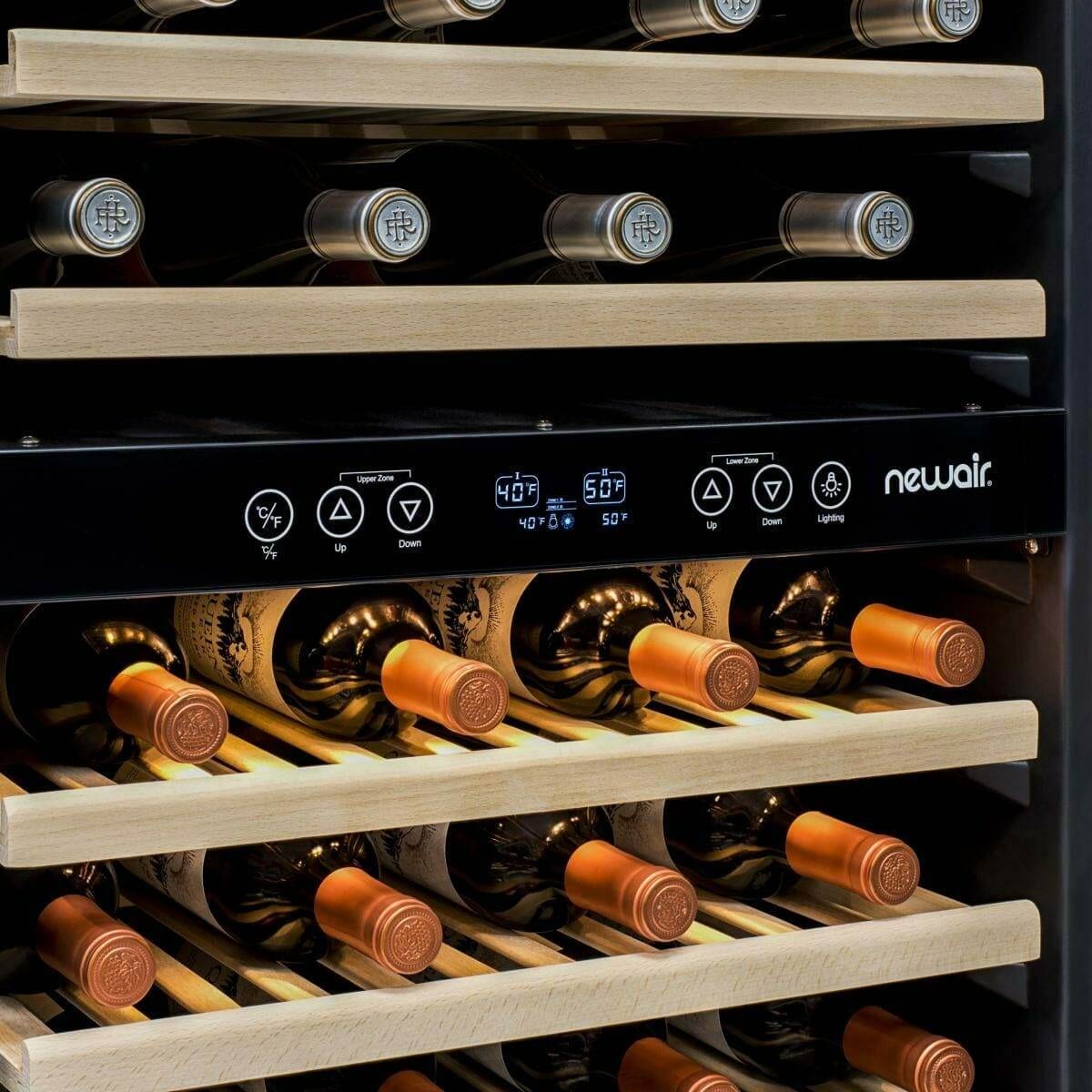 Close-up of wine bottles and control panel inside a NewAir wine fridge
