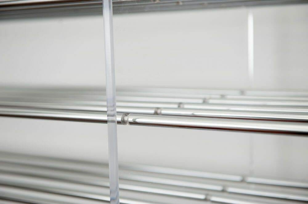 Close-up of an acrylic panel edge on an Evolution wine rack
