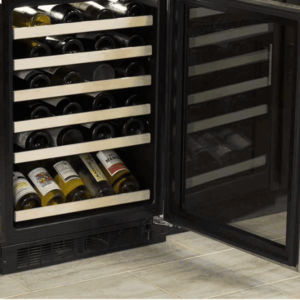 Wine bottles arranged on a Marvel wine refrigerator's wood-trimmed shelf