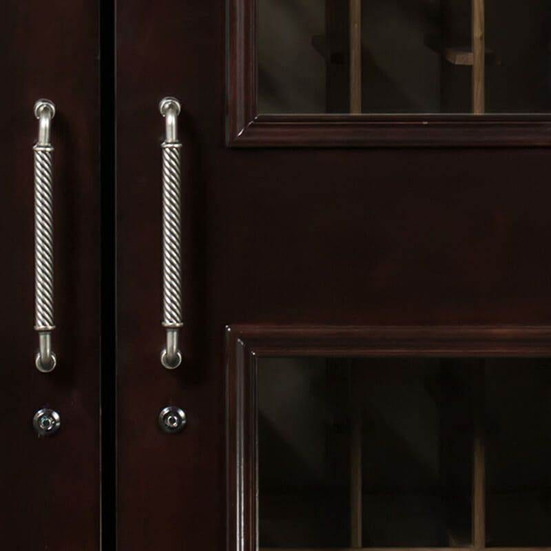 Close-up of Le Cache chocolate finish cabinet door handles and glass panels