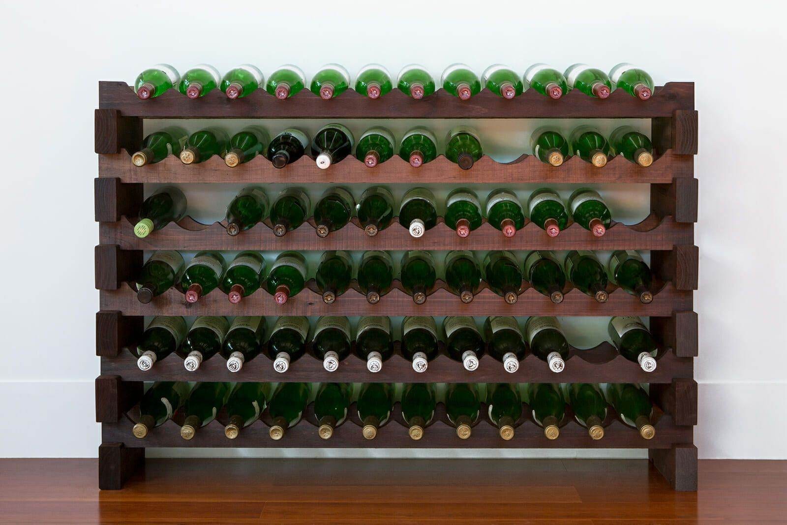 Stained 6x12 modular wine rack filled with wine bottles