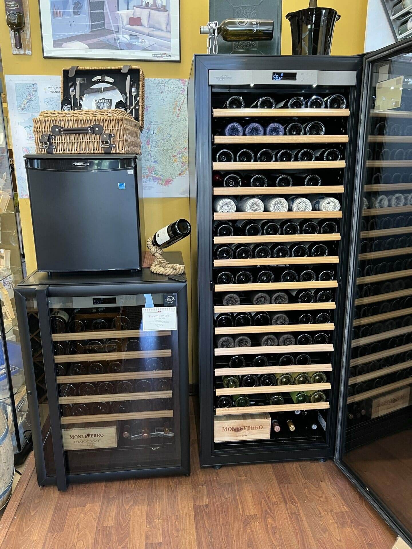 Showroom pairing of a small wine fridge and tall Transtherm cabinet beside wicker basket