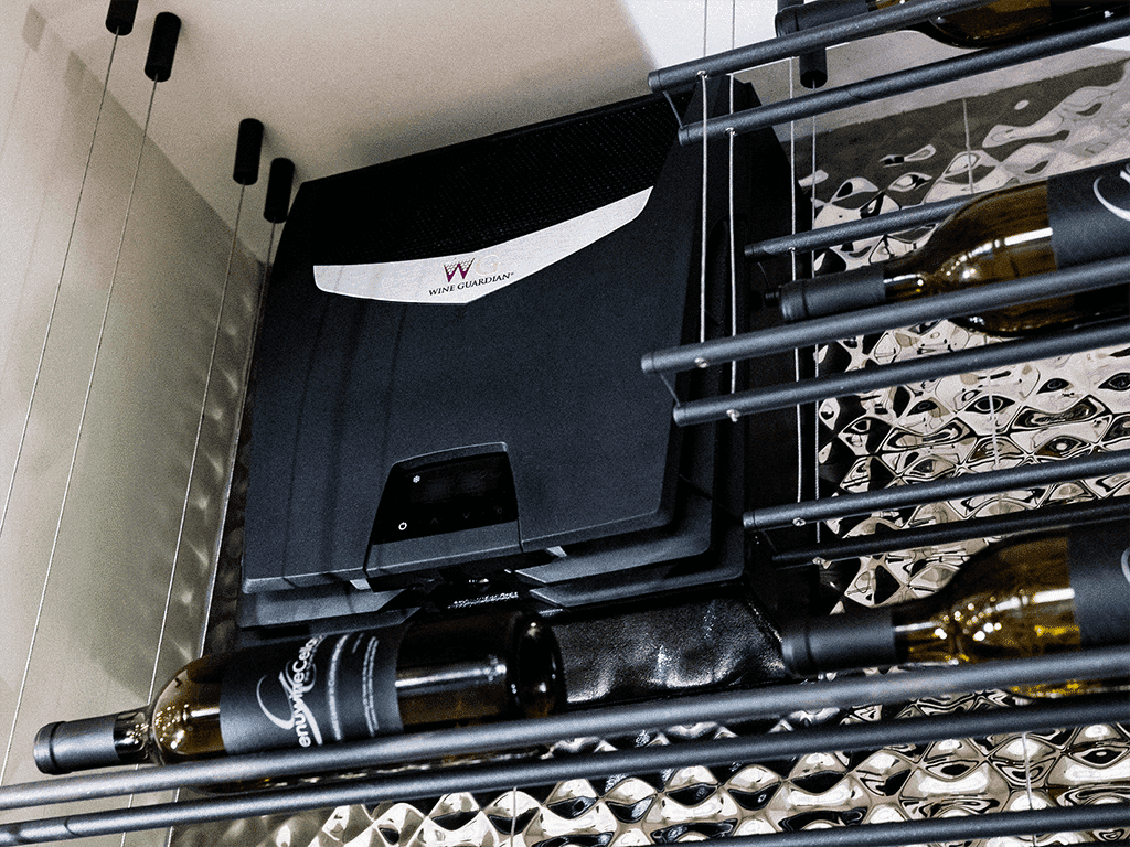 A Wine Guardian cooling unit installed above a mirrored wine rack